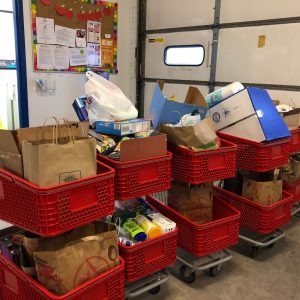 Red shopping carts full of groceries and donations
